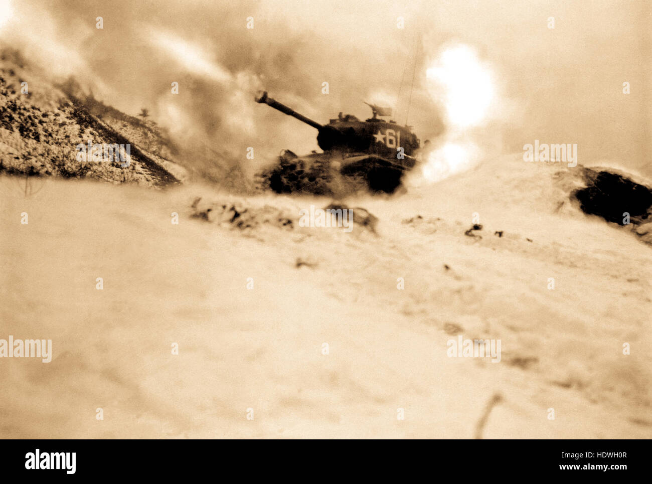 Near Song Sil-li, Korea, a tank of 6th Tank Battalion fires on enemy positions in support of ground troops. Stock Photo