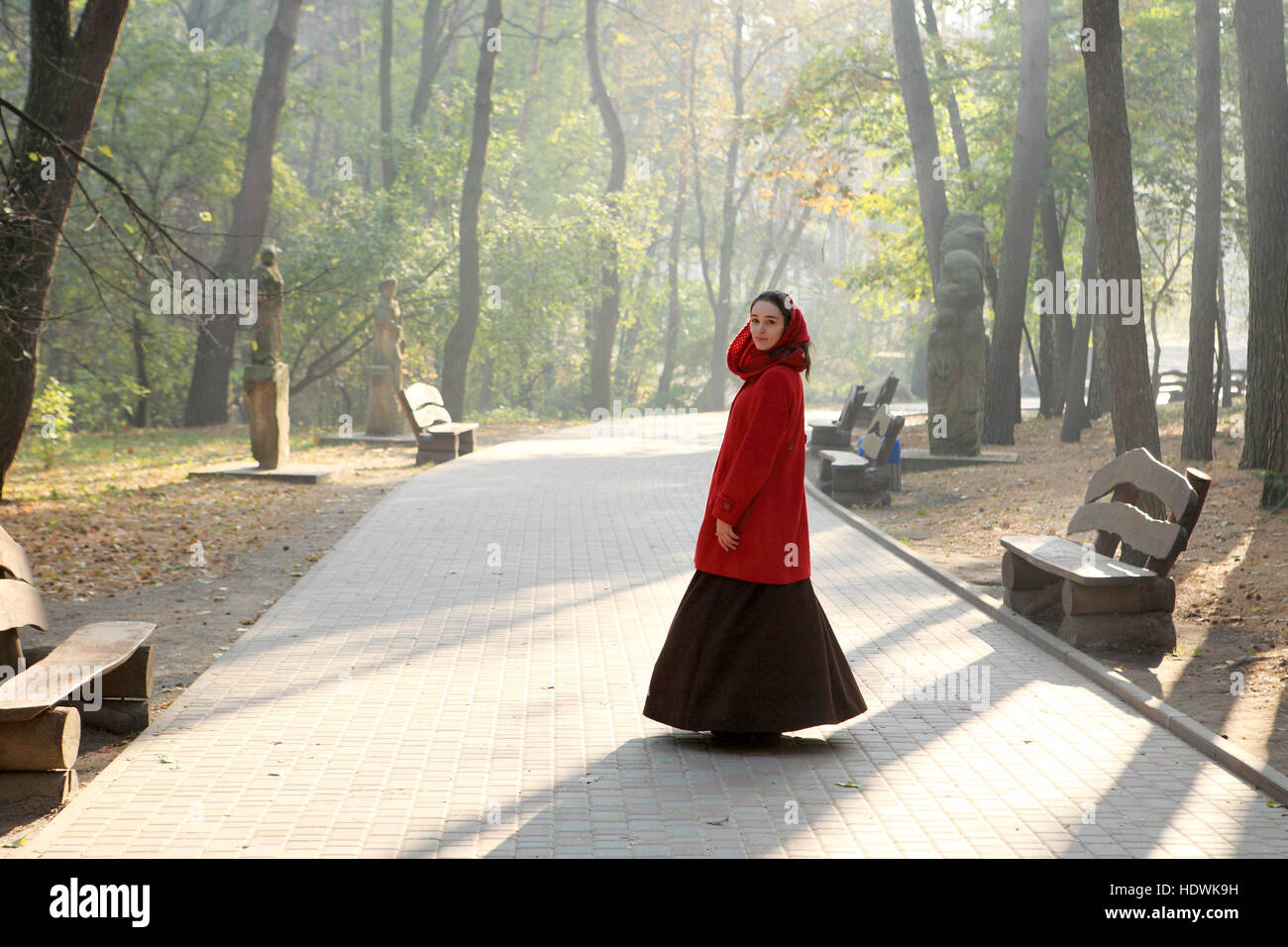 Girl in a black hat for a walk in the autumn park Stock Photo - Alamy