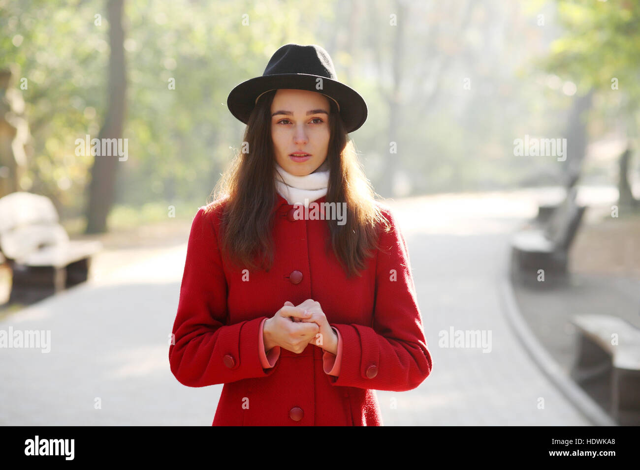 Girl in a black hat for a walk in the autumn park Stock Photo - Alamy