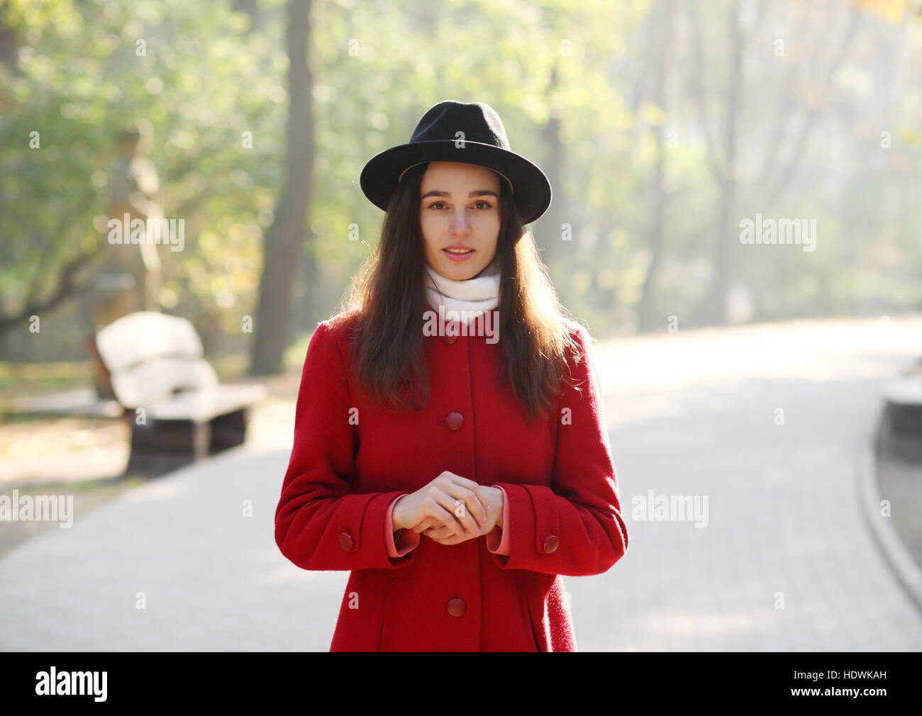 Girl in a black hat for a walk in the autumn park Stock Photo - Alamy