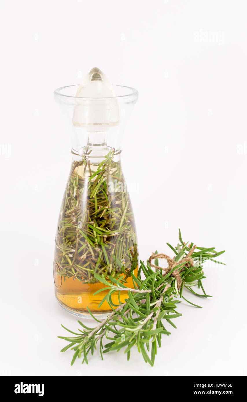 rosemary oil in a vintage glass bottle Stock Photo
