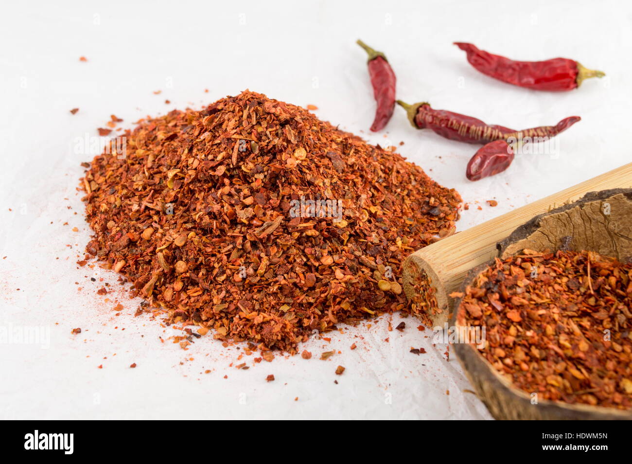 Ground red pepper and dried peppers closeup Stock Photo