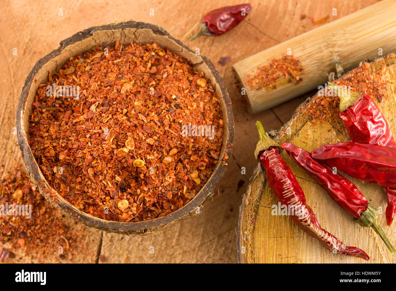 Ground red pepper and dried peppers closeup Stock Photo