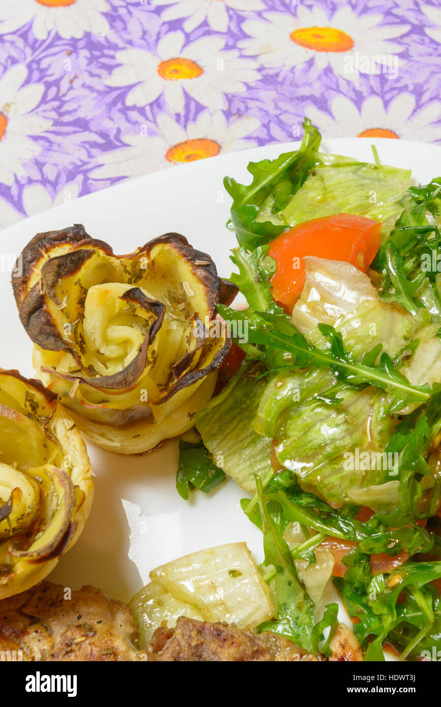 Italian style green salad and potatoes with tomatoes Stock Photo