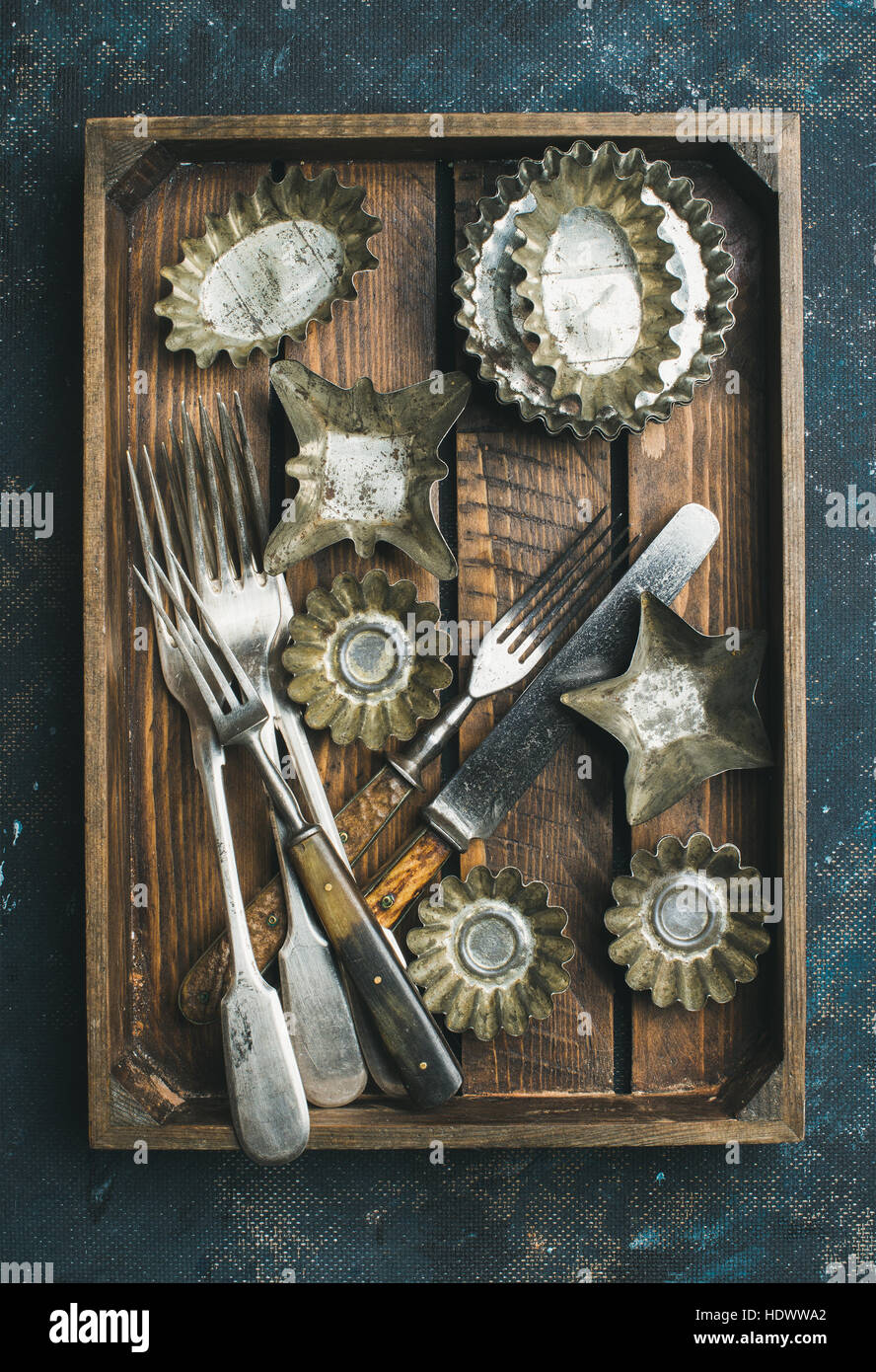 Old vintage tin baking molds and cutlery in wooden tray Stock Photo Alamy