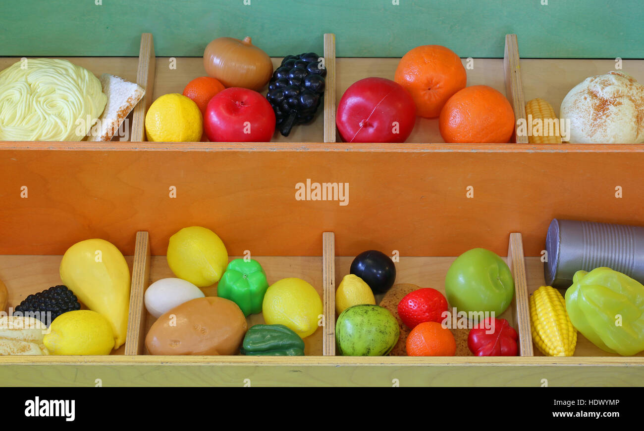 plastic fruit to play at the greengrocer during playtime at school Stock Photo