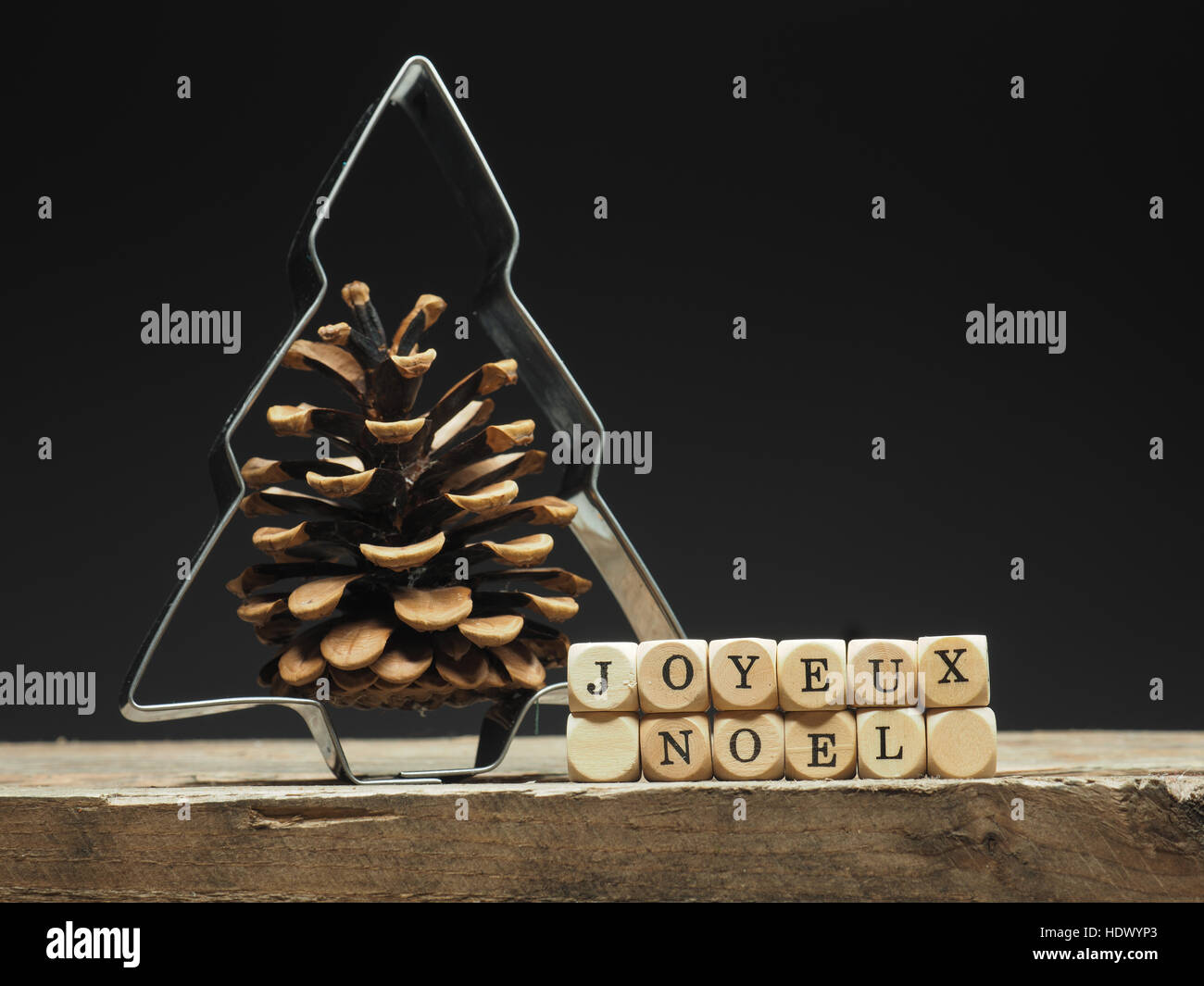 Baking Tin Christmas Tree Shape With The French Words Joyeux Noel Merry Christmas Background On Old Wooden Kitchen Table Stock Photo Alamy