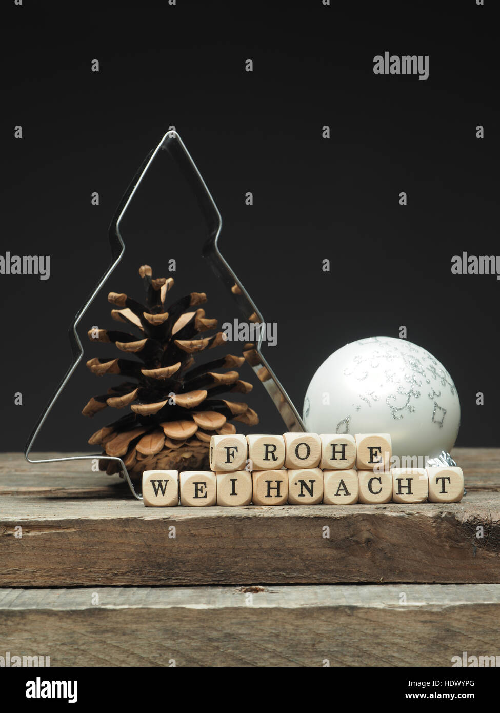 German Merry Christmas background with tree shape and small wooden