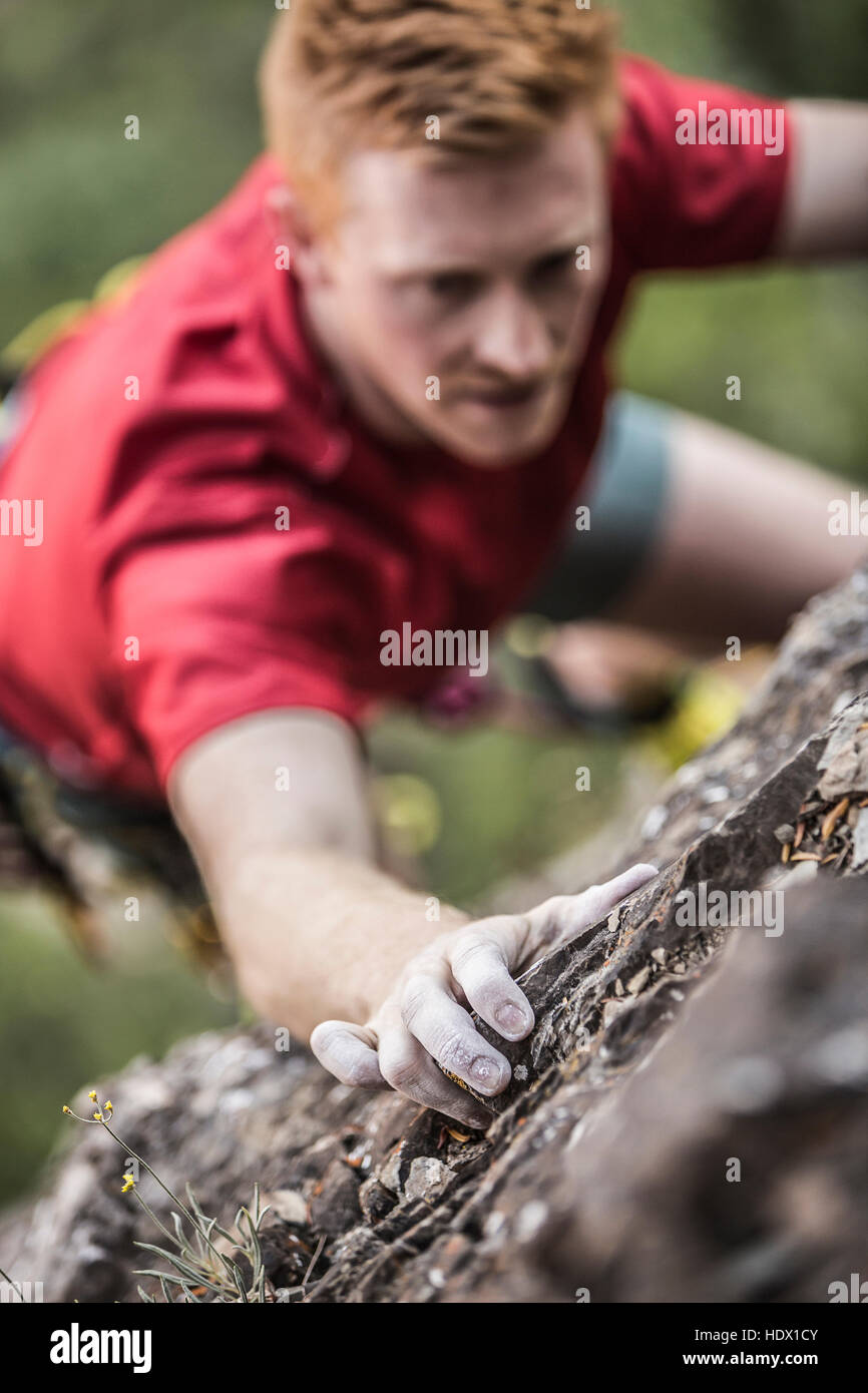 Caucasian man rock climbing Stock Photo Alamy