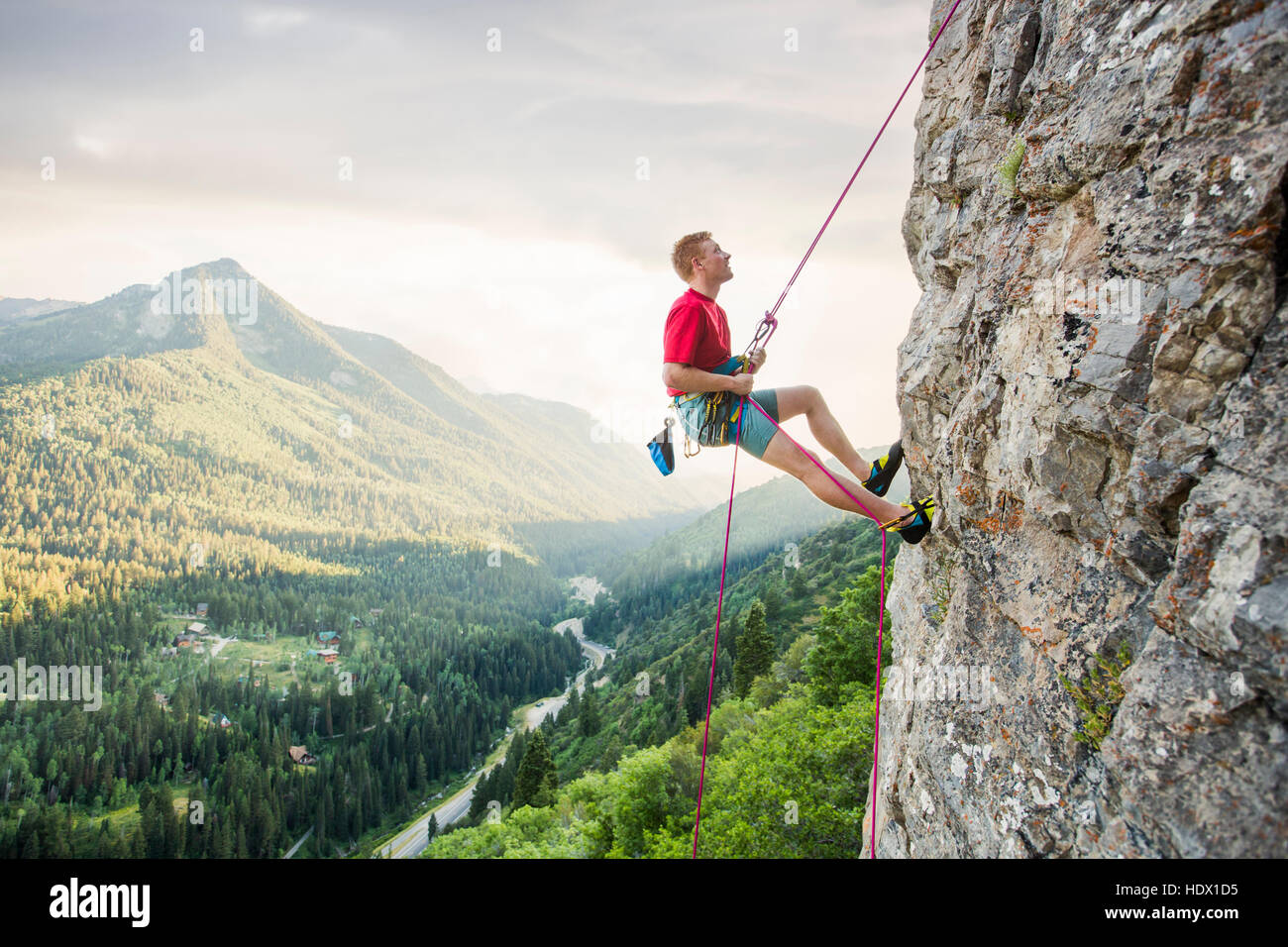 Caucasian man rock climbing Stock Photo