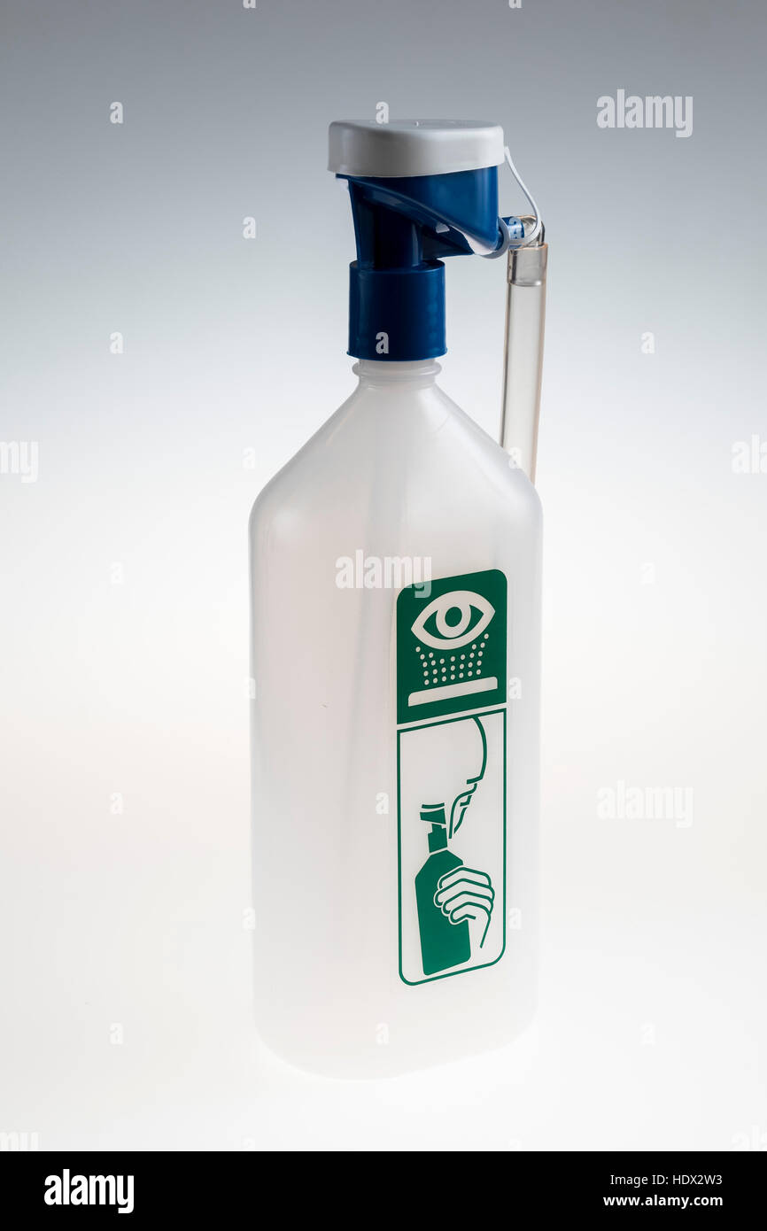 Eye Shower, eye wash, emergency first aid device, bottle with water to clean burned eyes Stock Photo