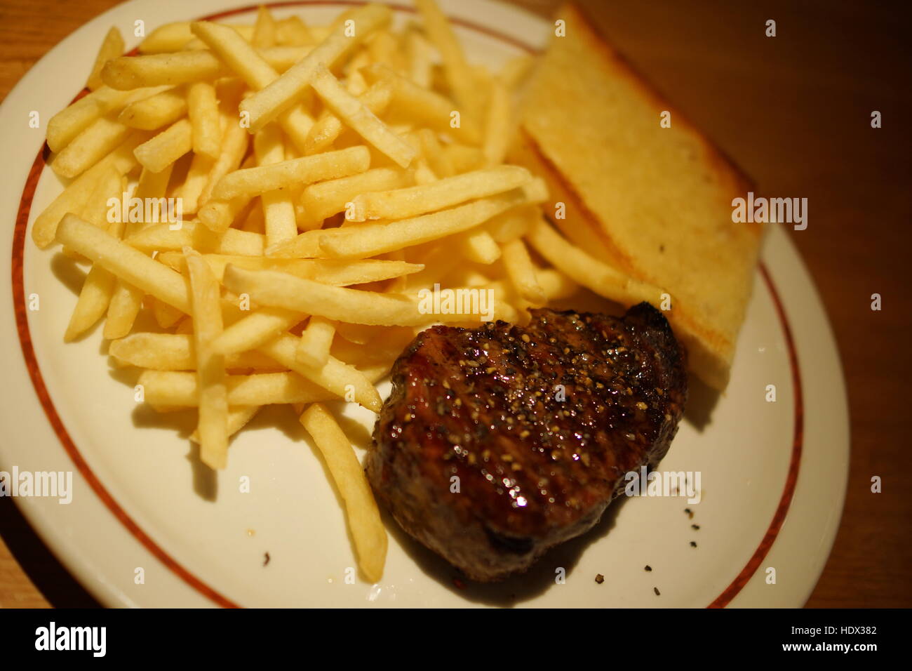 Delicious steak with fried potatos Stock Photo