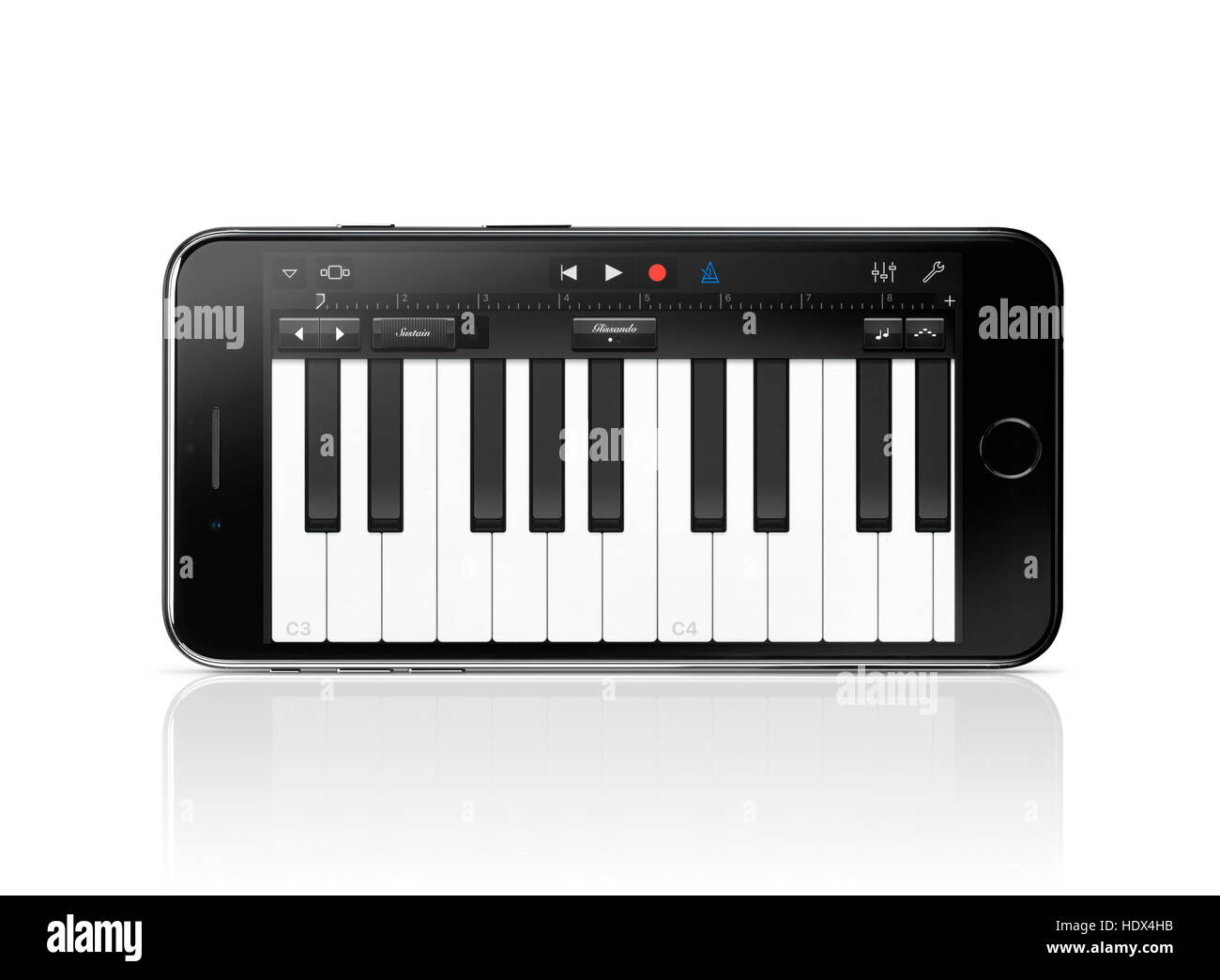 Apple iPhone 7 Plus with piano keyboard Garage Band Apple music app on its display isolated on white background with clipping path Stock Photo