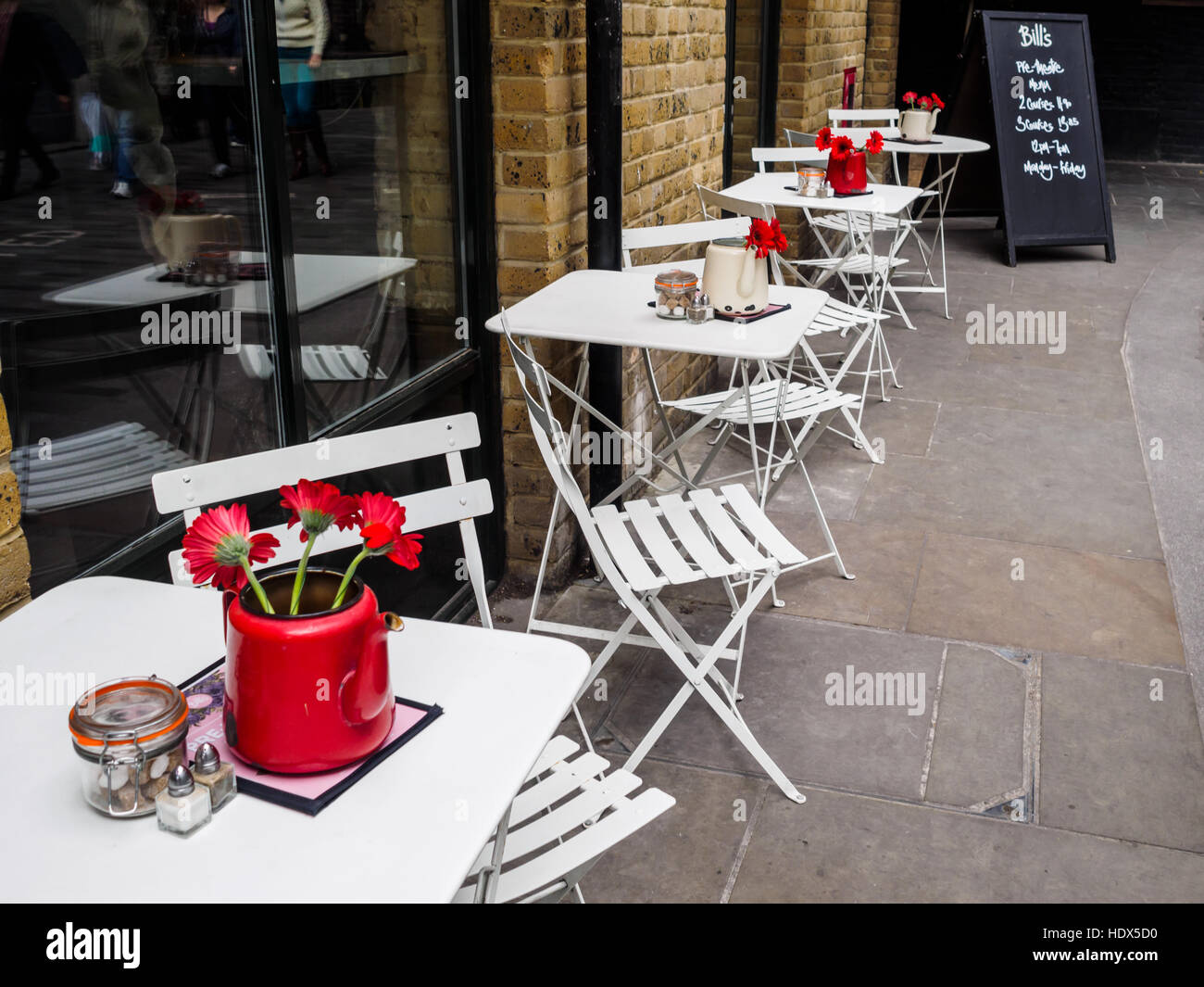 Empty bistro tables for two outside a restaurant in Southwark, London, England, UK. Stock Photo