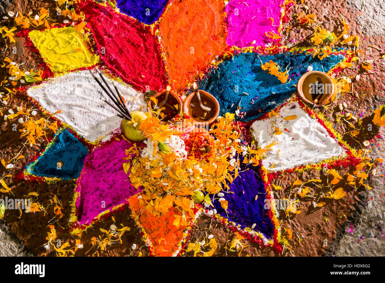 A colorful mandala is made from colorpowder and candles for the Tihar festival Stock Photo