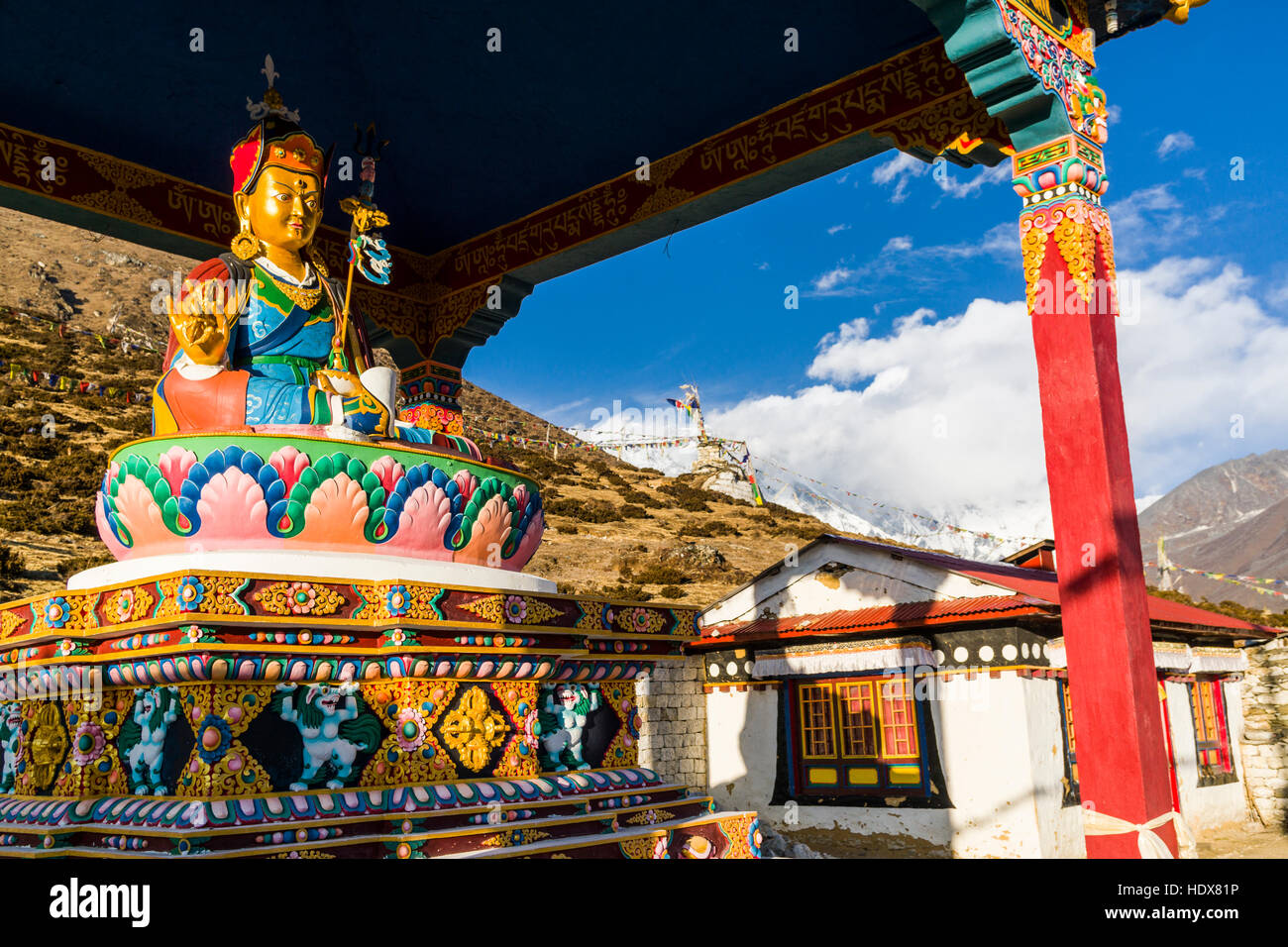 The colorful statue of Padmasambhava is erected on the slope of a hill Stock Photo