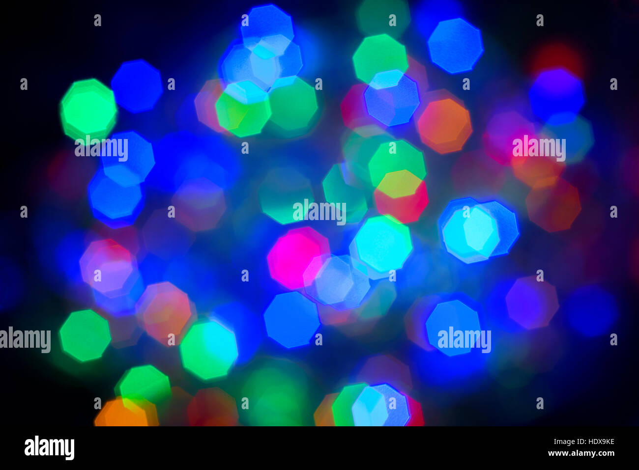 Defocussed Christmas colourful lights. Stock Photo