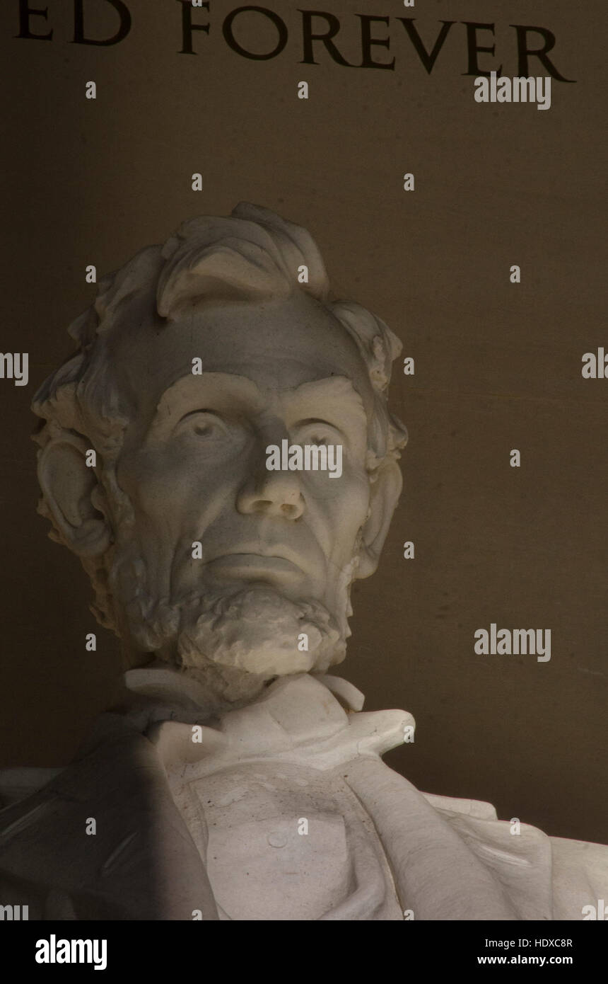 Lincoln's face emerges from the shadows at the Lincoln Memorial, on the National Mall in Washington, DC. Stock Photo