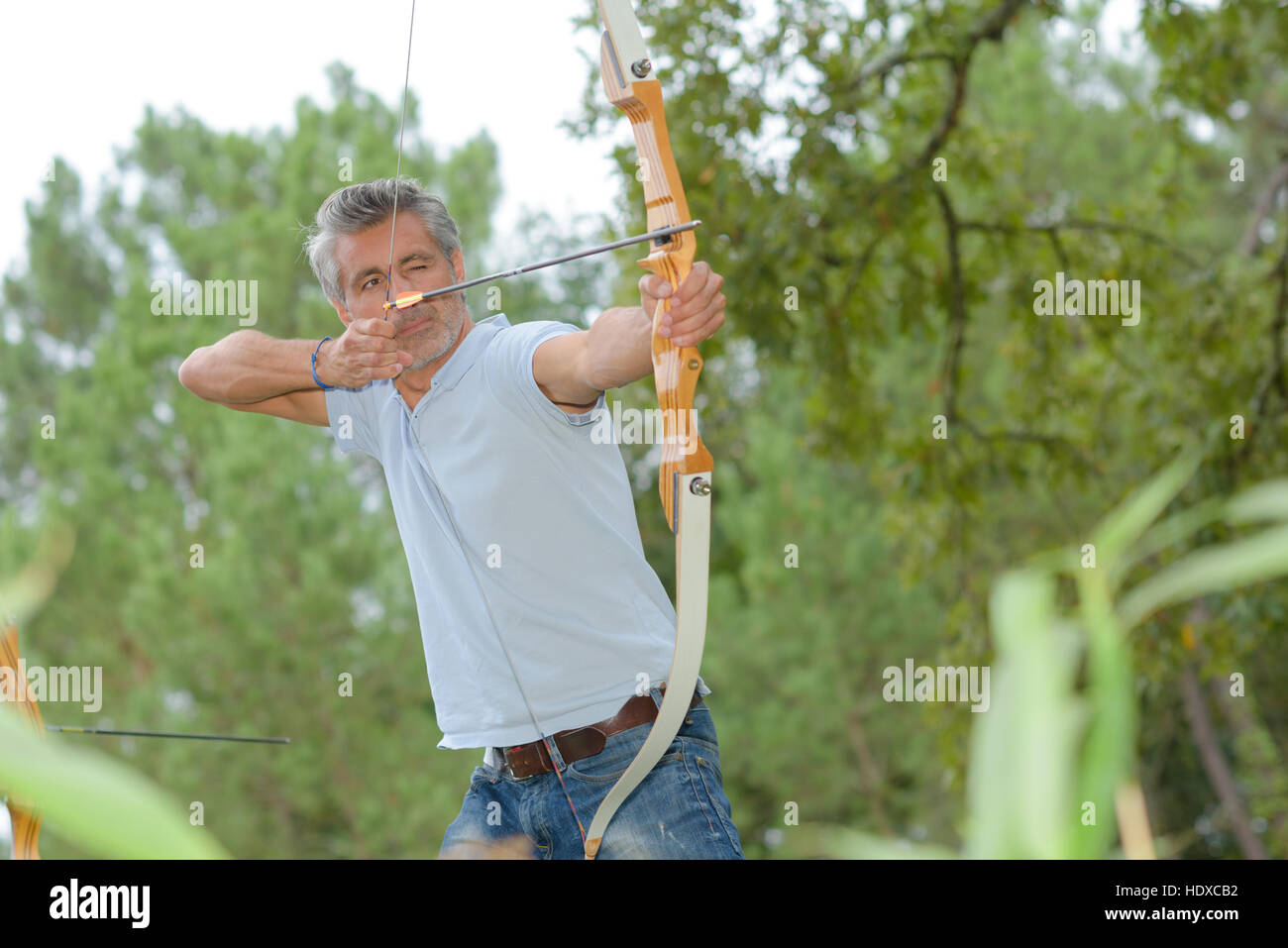 hunting using a bow and arrow Stock Photo Alamy