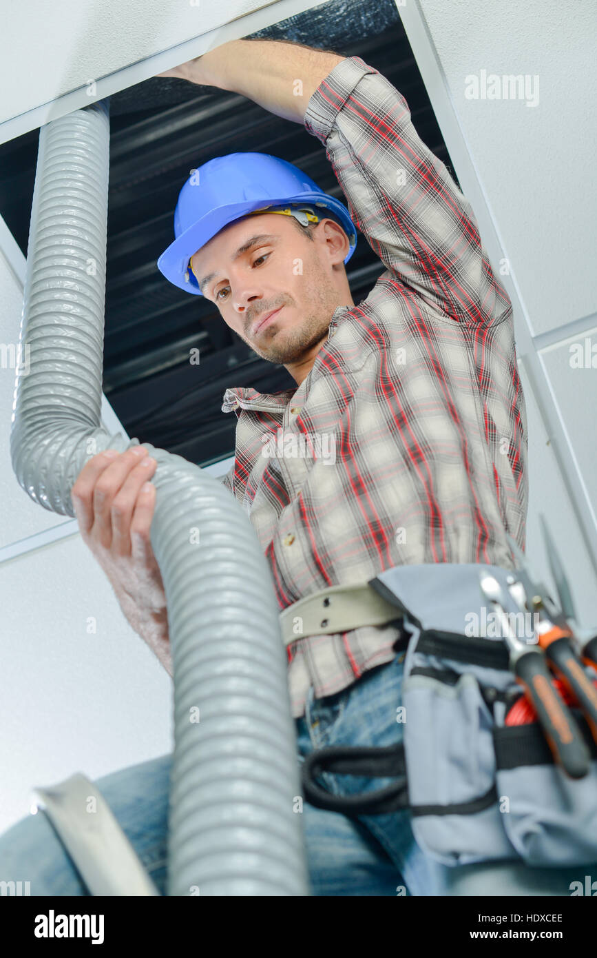 worker doing the ventilation system Stock Photo Alamy