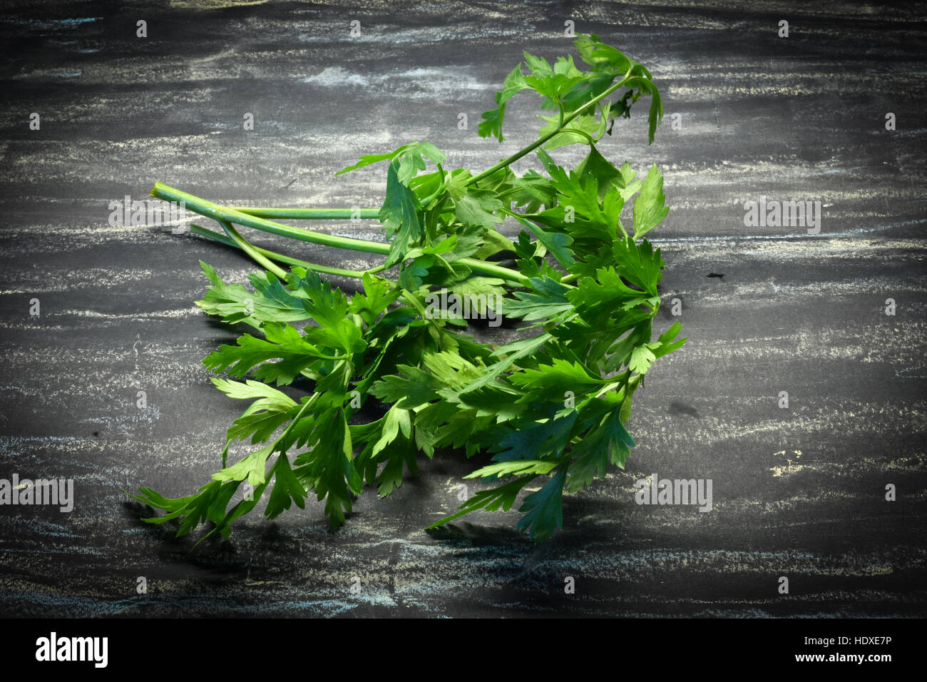 Bunch of fresh green parsley isolated on black background Stock Photo ...