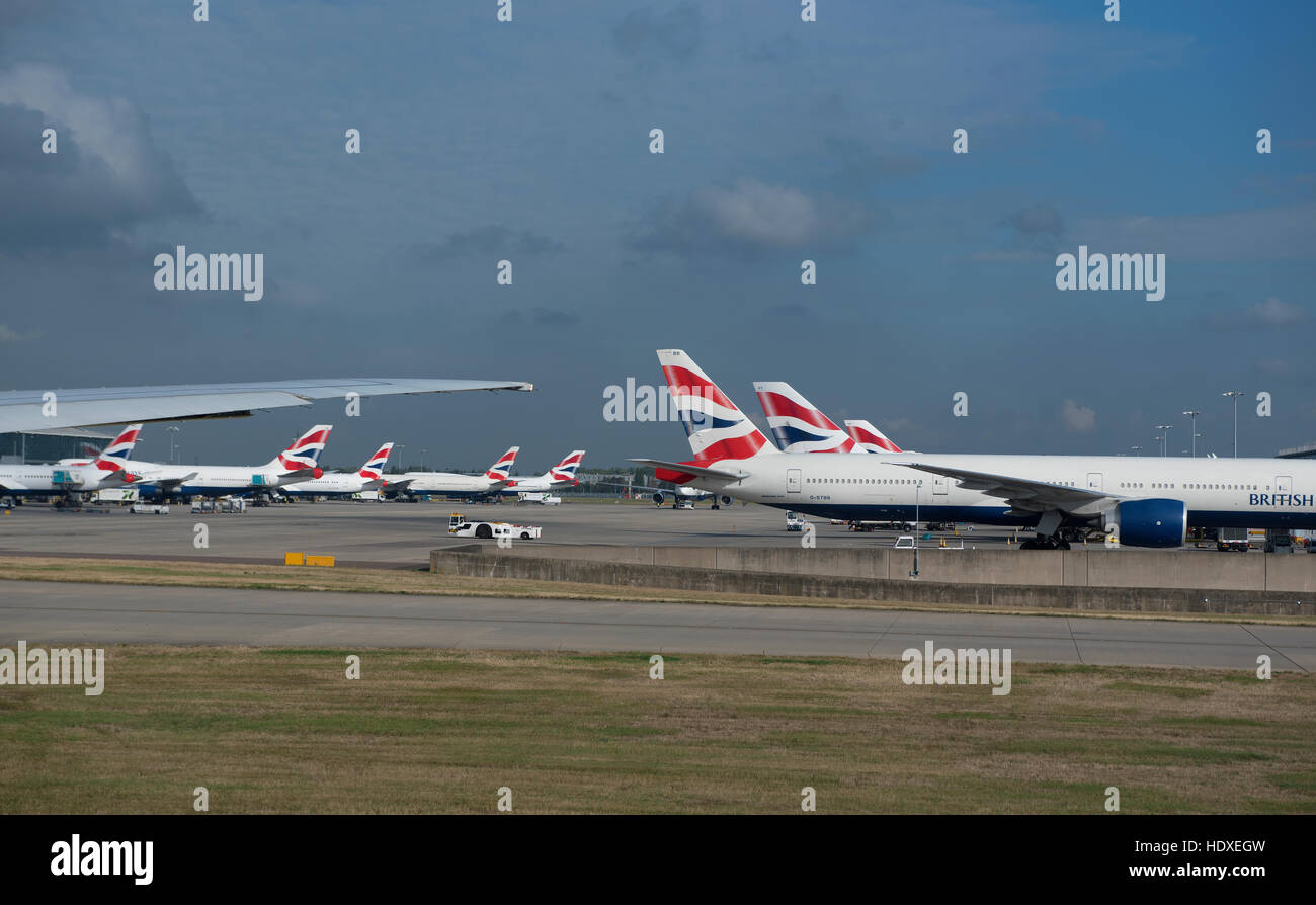 British Airways aircraft fleet parked outside terminal 2 at Heathrow Airport London UK  SCO 11,274. Stock Photo