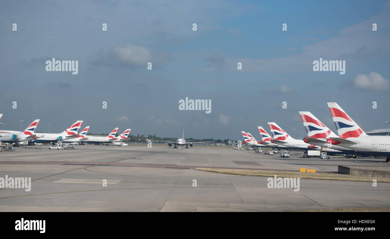 British Airways aircraft fleet parked outside terminal 2 at Heathrow Airport London UK  SCO 11,275. Stock Photo