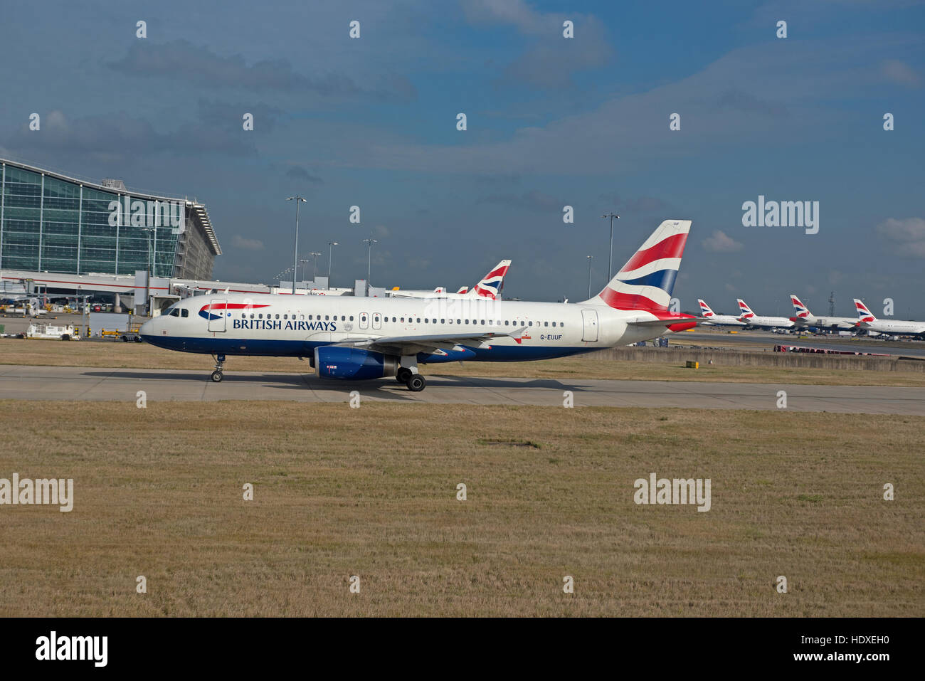 British Airways aircraft parked outside terminal 2 at Heathrow Airport London UK  SCO 11,277. Stock Photo