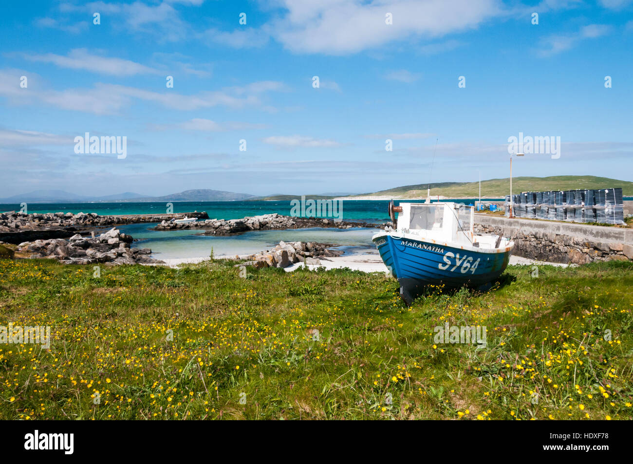 A fishing boat at the small harbour of Eoligarry on the Isle of Barra in the Outer Hebrides. Stock Photo