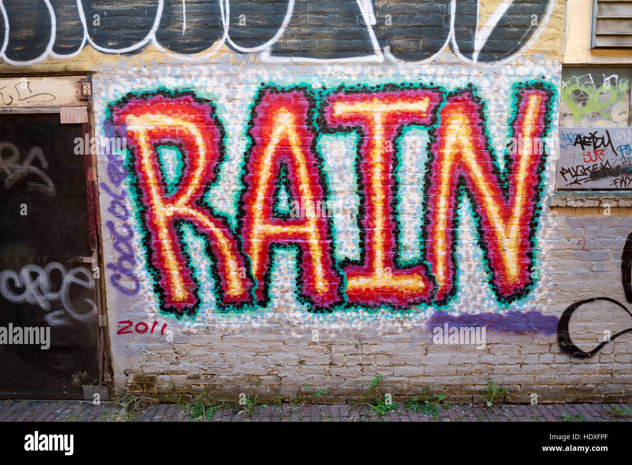 "Rain" graffiti painted on a wall in Olympia, Washington Stock Photo ...