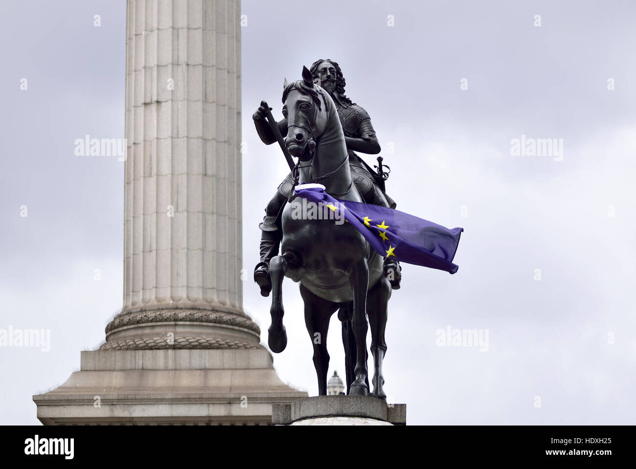 London, England, UK. Statue (1633: Hubert le Sueur) of King Charles I (1600-49) in Trafalgar Square, with EU flag. London's oldest equestrian statue.  Stock Photo