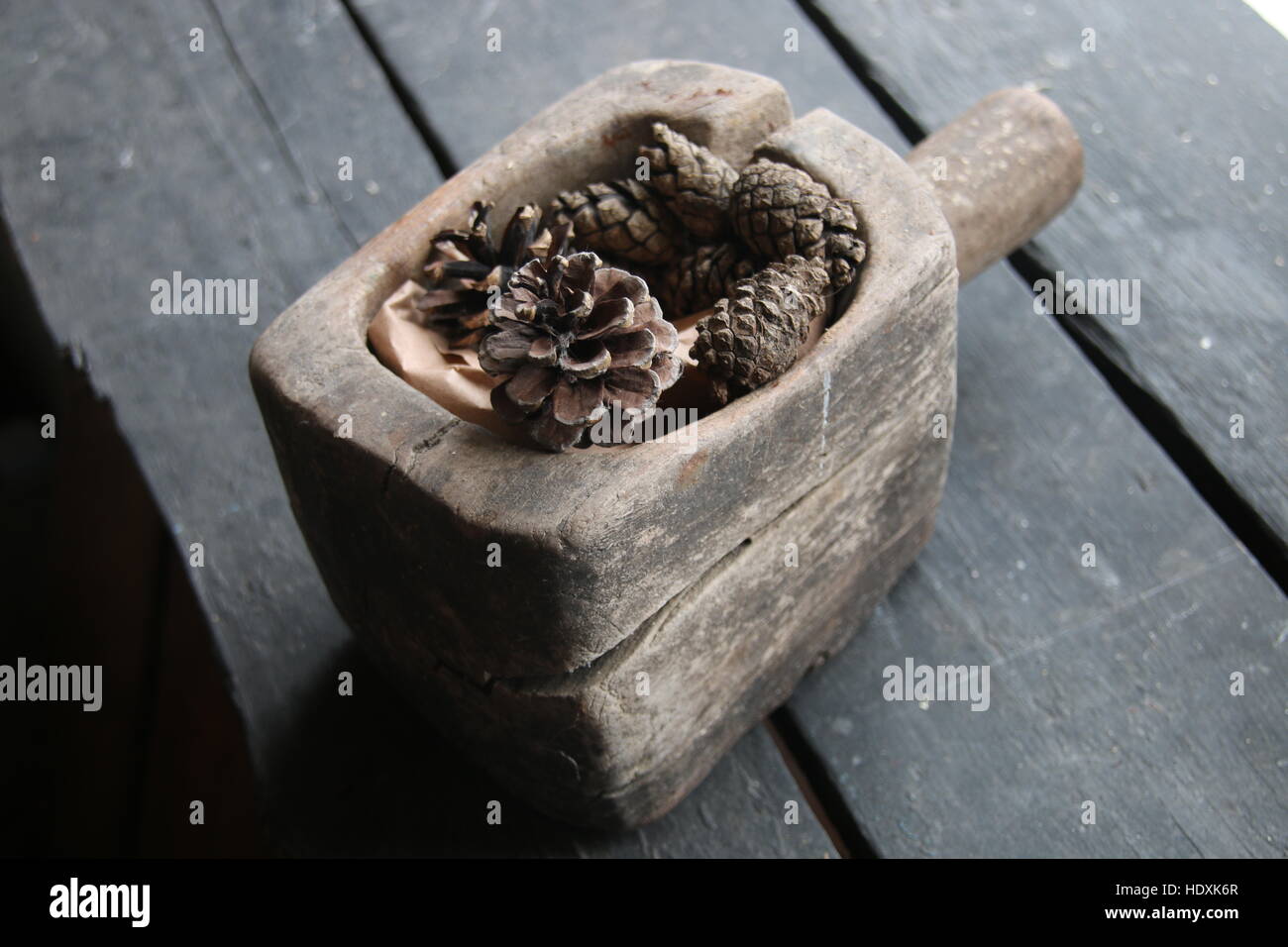 pine cone Christmas decoration on old rustic wooden table Stock Photo