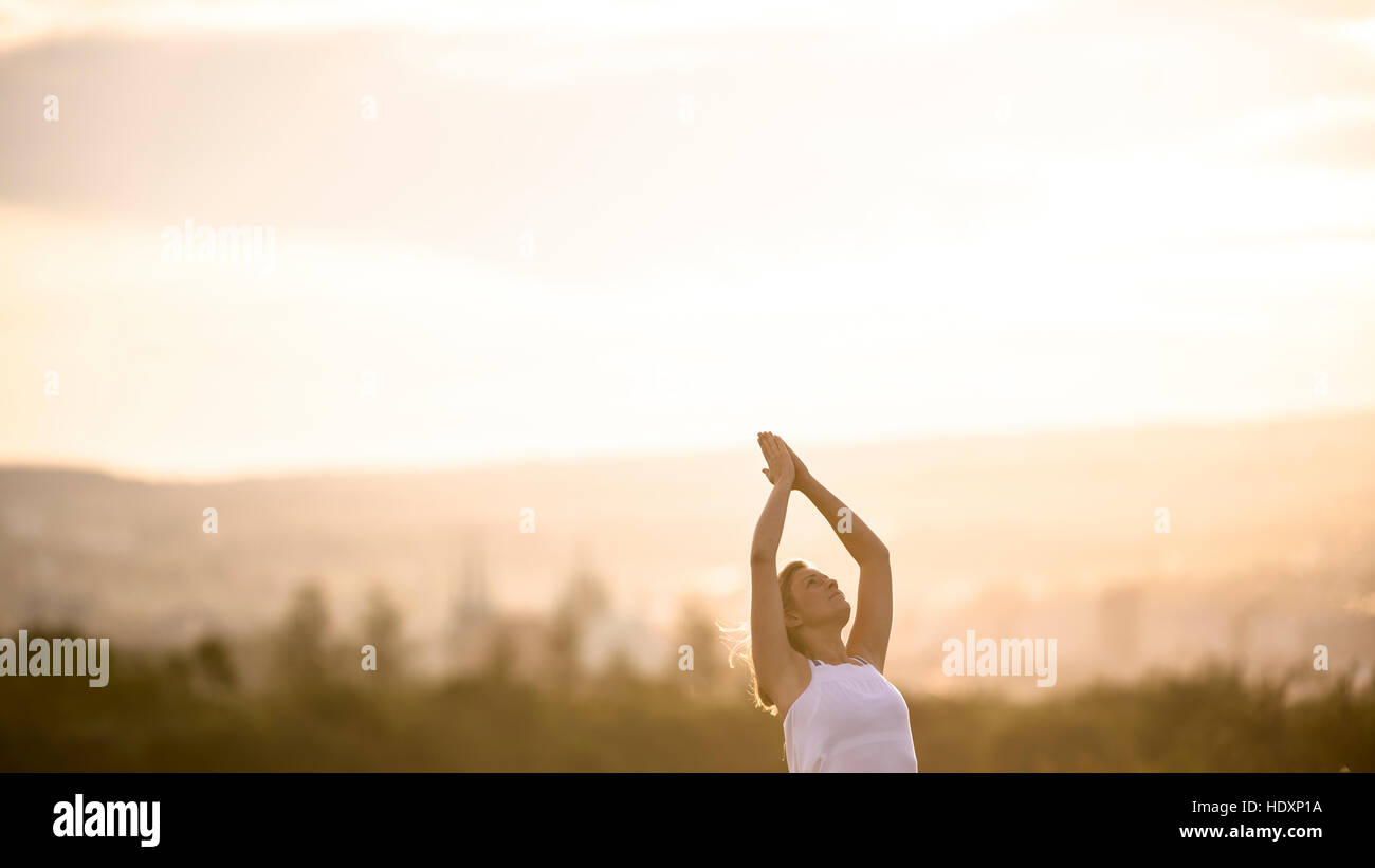 Woman doing yoga exercises Stock Photo