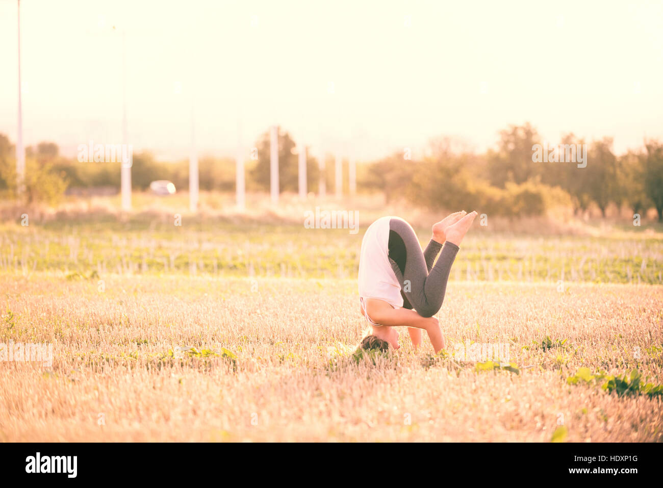 Woman doing yoga exercises Stock Photo