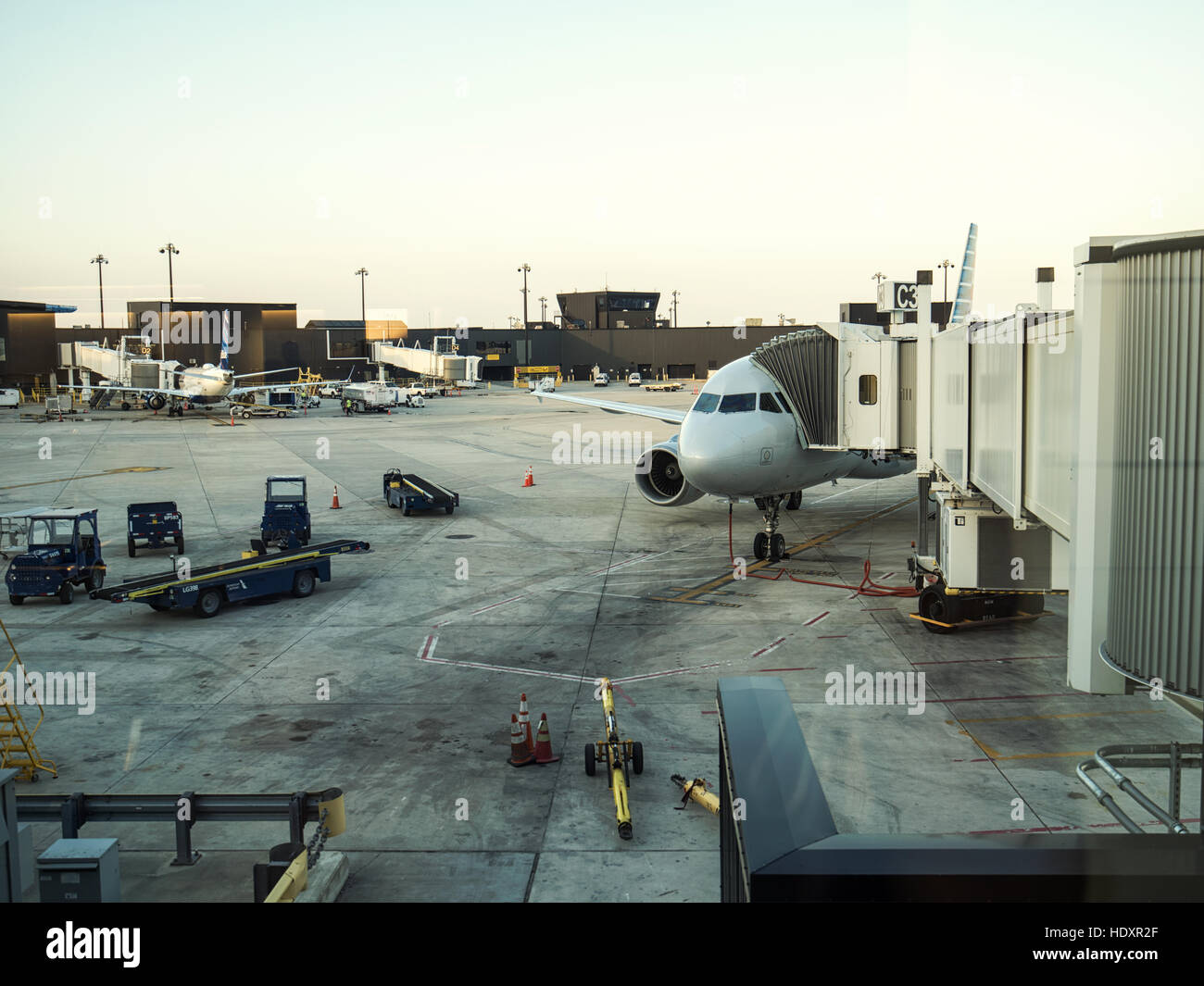 Airplane at an airport terminal gate preparing for an early flight. Baltimore Washington International, BWI. Stock Photo