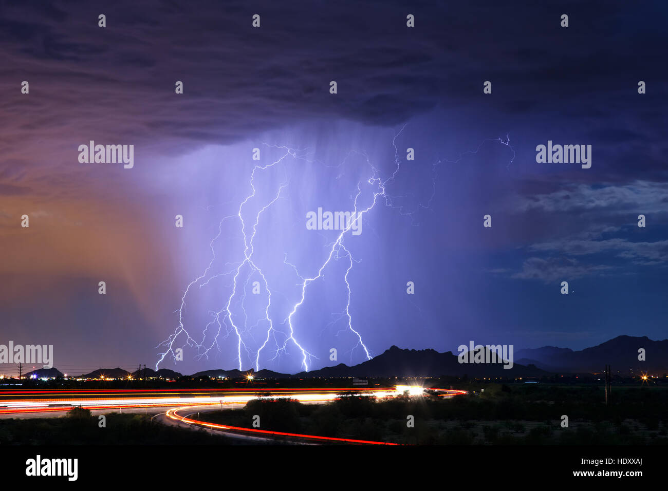 Series of lightning bolts striking a mountain during a thunderstorm in ...