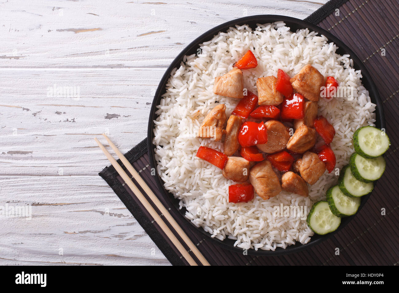 Pieces of chicken with rice on a plate. horizontal view from above ...