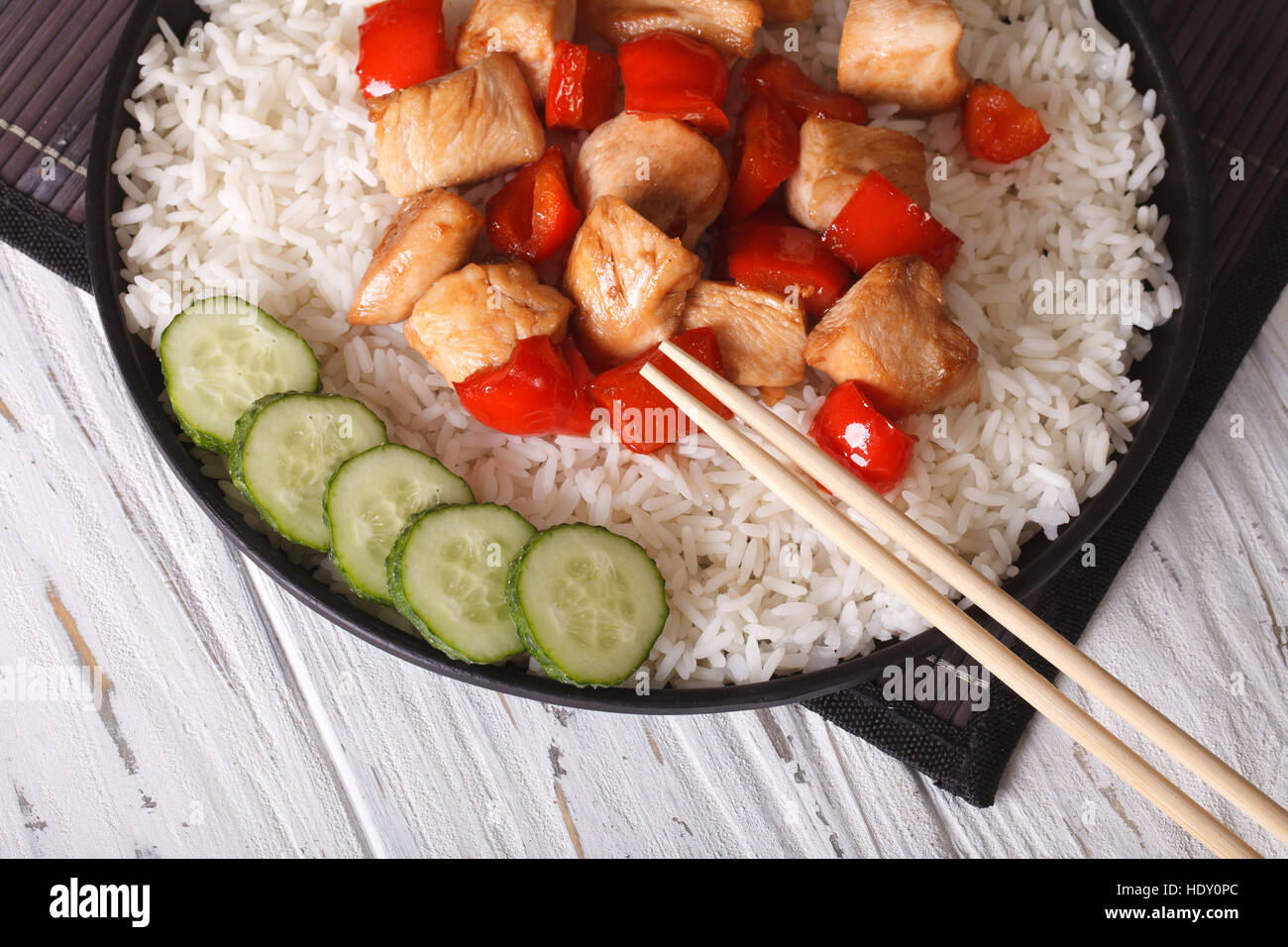 Chinese food: rice with chicken and teriyaki sauce closeup. horizontal view from above Stock Photo