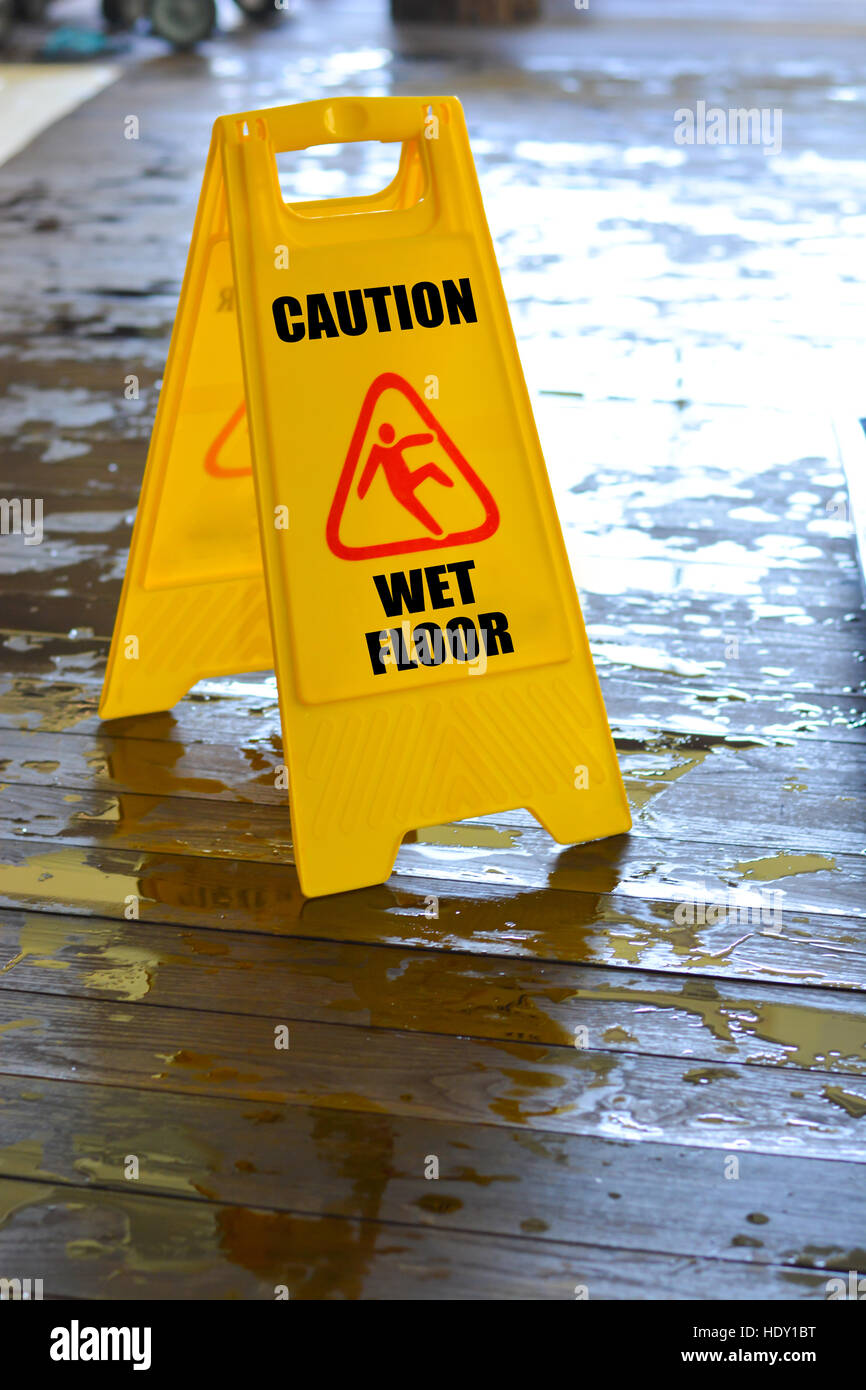 Caution wet floor yellow sign Stock Photo Alamy