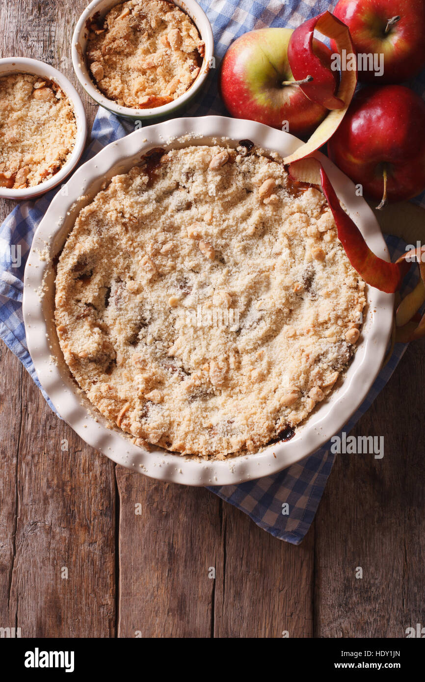 Traditional apple crisp close-up in baking dish. view from above vertical, rustic style Stock Photo