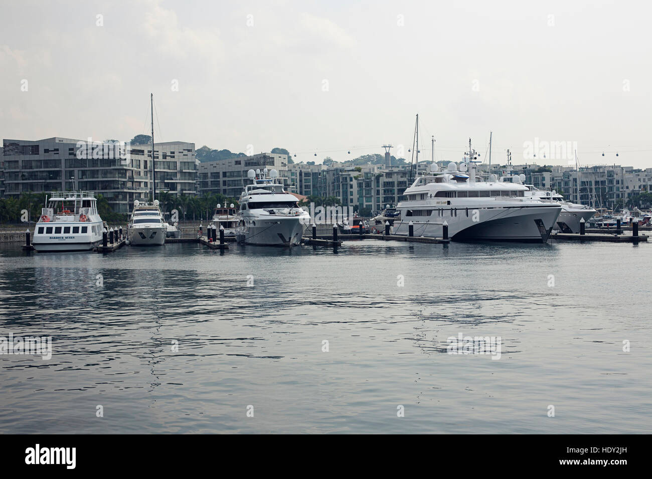 Moored yachts in luxury residential in Singapore City Stock Photo