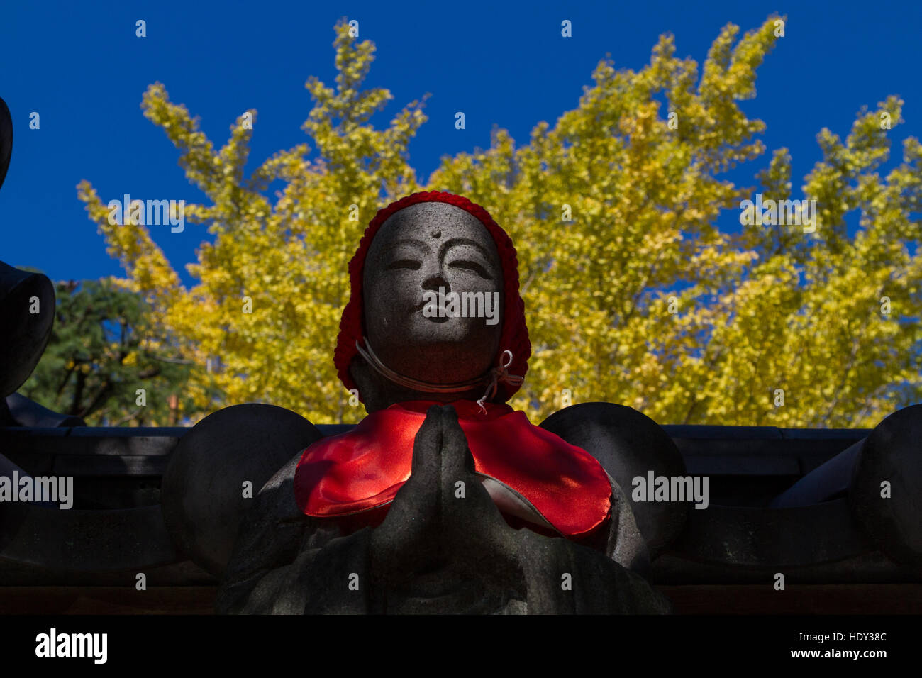 A Jizo statue outside a shrine in Kiyosumi, Tokyo, Japan Stock Photo