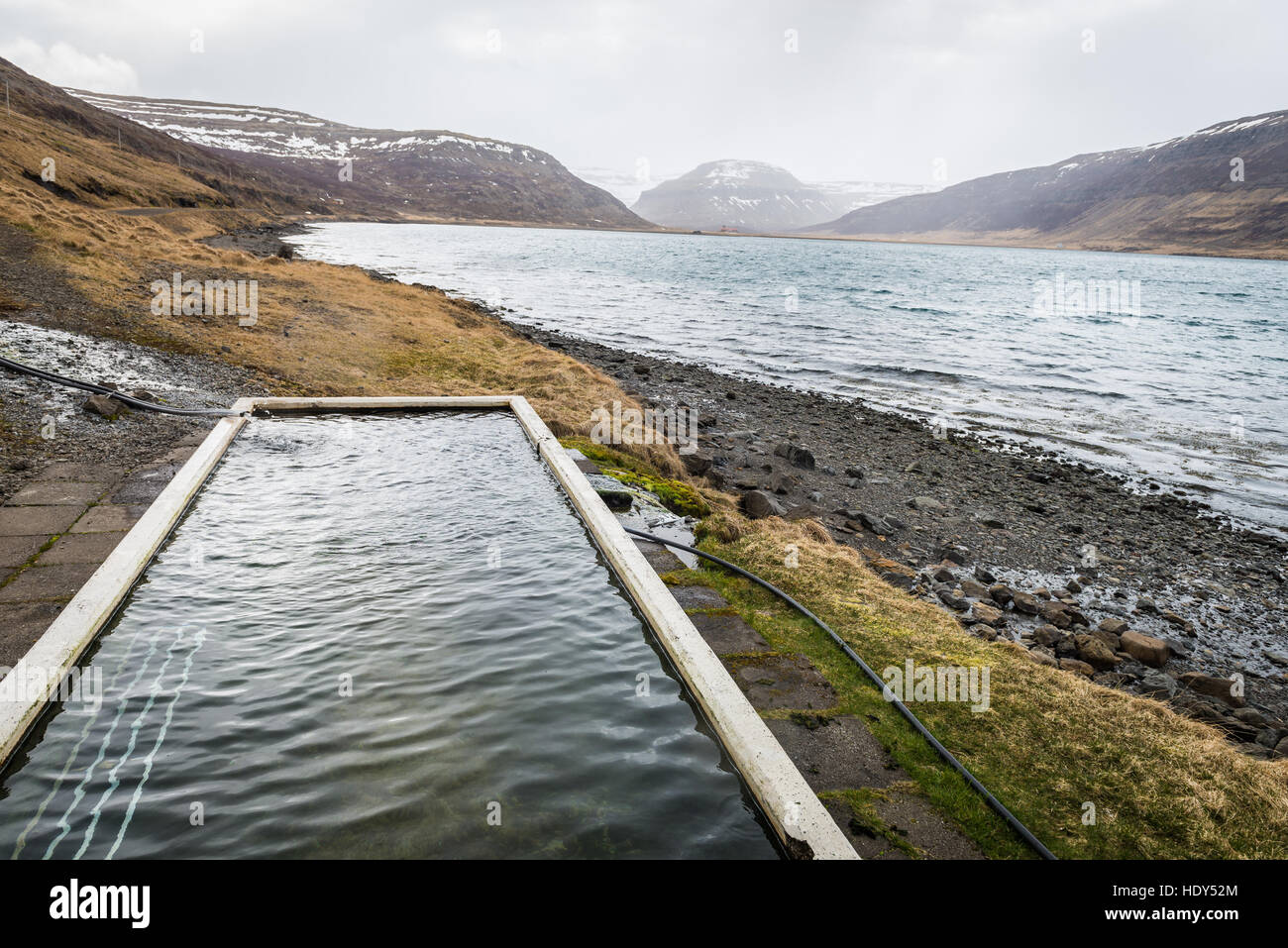 Photo of the hot pot surrounded by mountains in Iceland Stock Photo Alamy