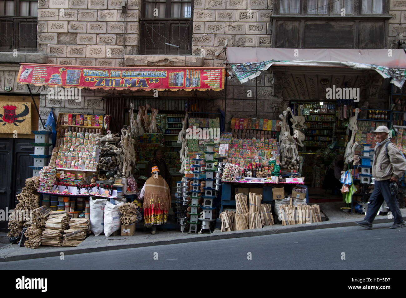 Street in La Paz, Bolivia, a shop sells dried llama fetuses, wood and other items to prepare offerings to the pachamama Stock Photo