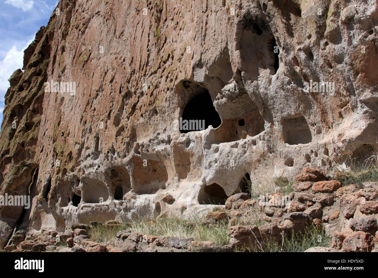 Bandelier cliff dwellings carved out of the cliffs by early pueblo people of the southwest creating a system of living spaces. Stock Photo