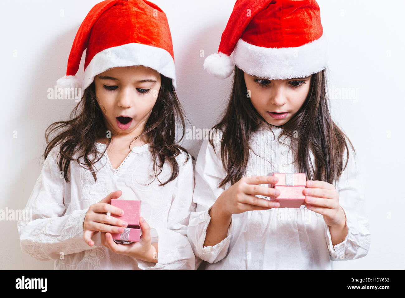 Two girls posing for Christmas and New Year holidays Stock Photo - Alamy