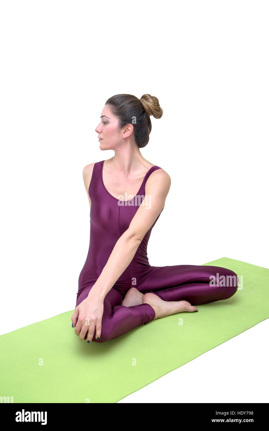 Young woman practicing yoga in the studio Stock Photo