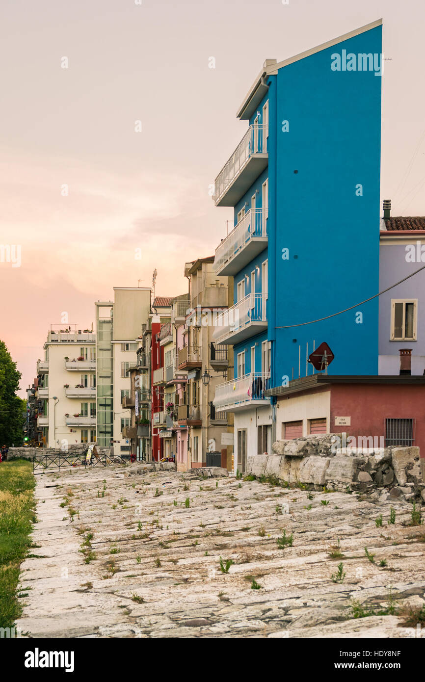 Typical houses in Sottomarina (Italy) with the embankment that protects them from sea storms. Stock Photo