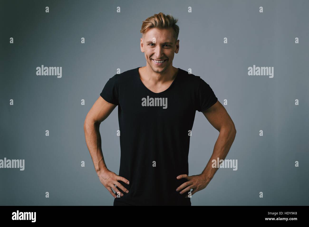 Handsome blond young man posing at studio Stock Photo - Alamy