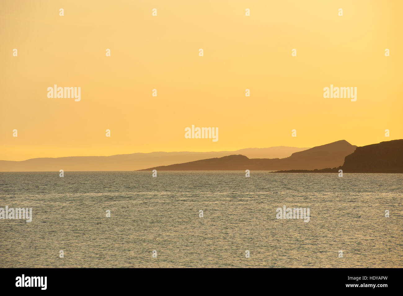 Looking across the Clyde estuary at sunset, towards Kintyre with the Isle of Bute infront Stock Photo